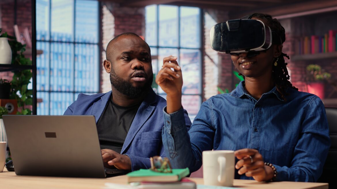 African professionals using virtual reality and AI tools in a modern workplace, symbolizing Artificial Intelligence in Human Resources transforming Africa’s jobs and skills.